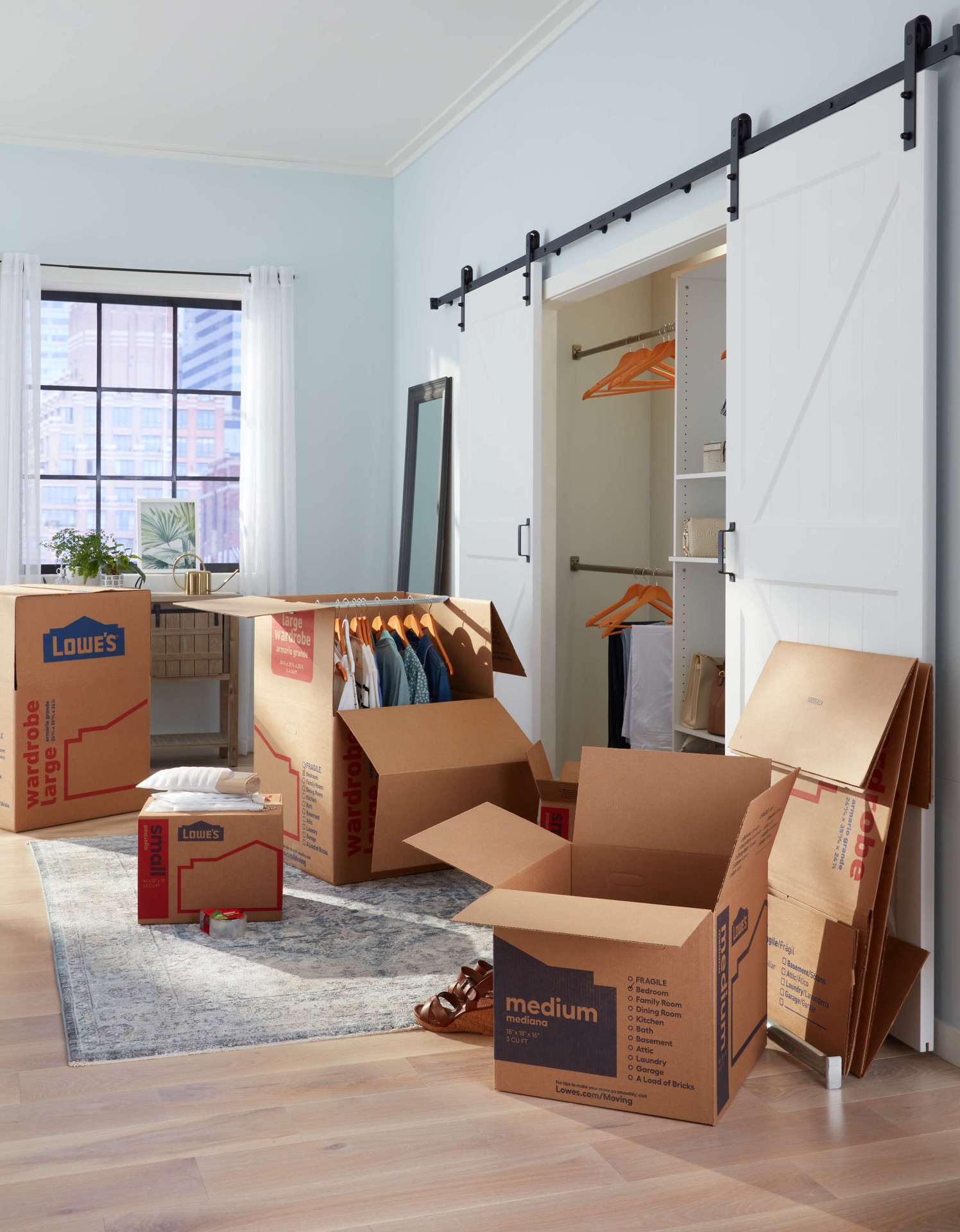 slide 3 of 6, Lowe's 24.4-in W x 35.8-in H x 24.8-in D With Metal Bar Large Cardboard Wardrobe Moving Box with Handle Holes, 1 ct