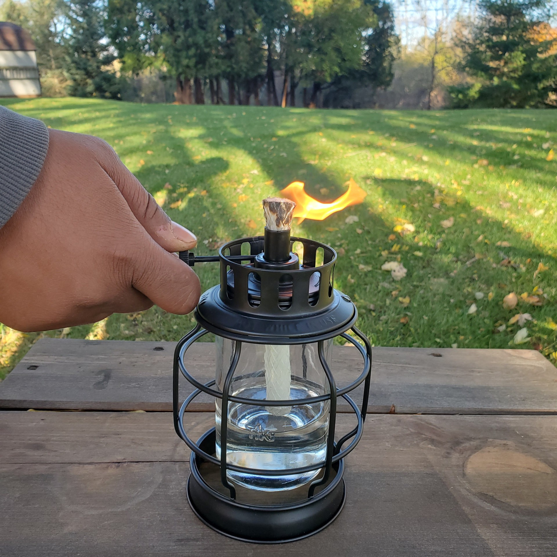 slide 4 of 6, TIKI 5.75 Inches Black Metal with Glass Glass Citronella Tabletop torch, 1 ct