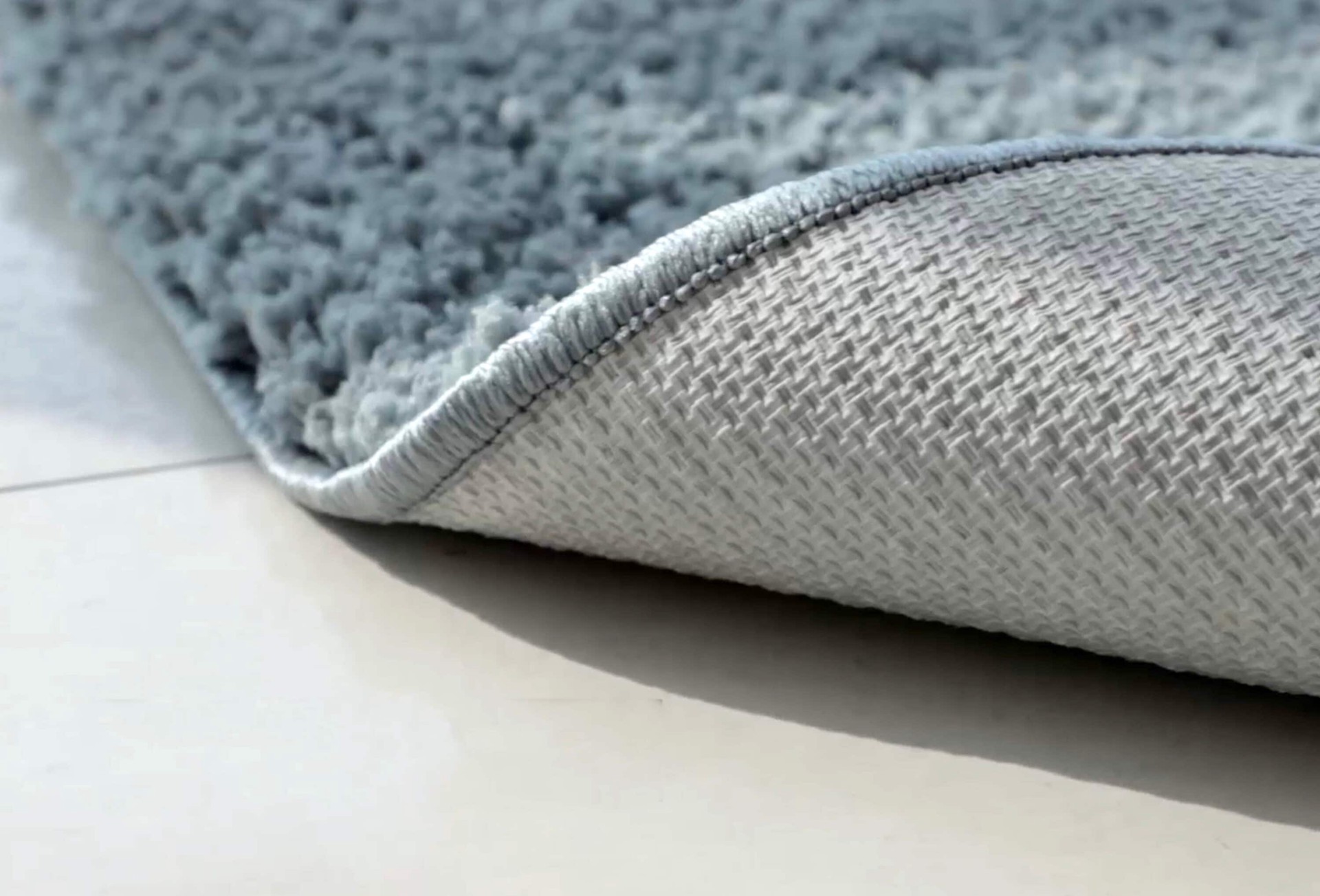 slide 4 of 5, Style Selections 5 x 7 (ft) Tufted Polyester Smoke blue Rectangular Indoor Solid Area rug, 1 ct