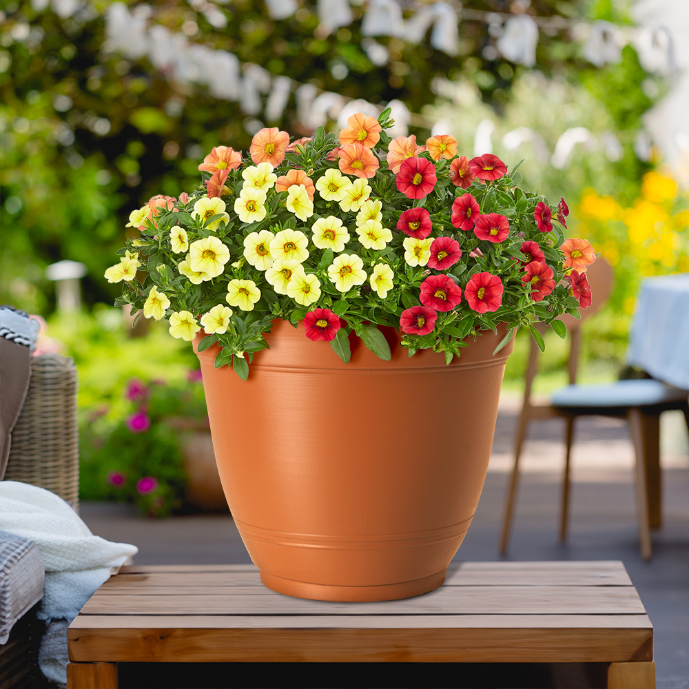 slide 2 of 4, Style Selections Round 6.02-in W x 5.12-in H Orange Recycled Plastic Indoor/Outdoor Planter, 1 ct