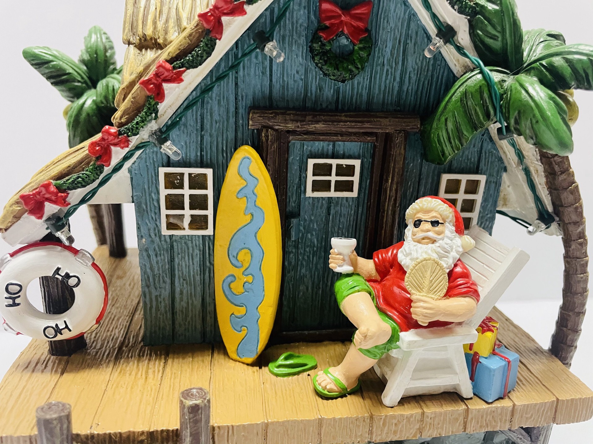 slide 3 of 5, Carole Towne Santa's Beach House Lighted Musical Village scene, 1 ct