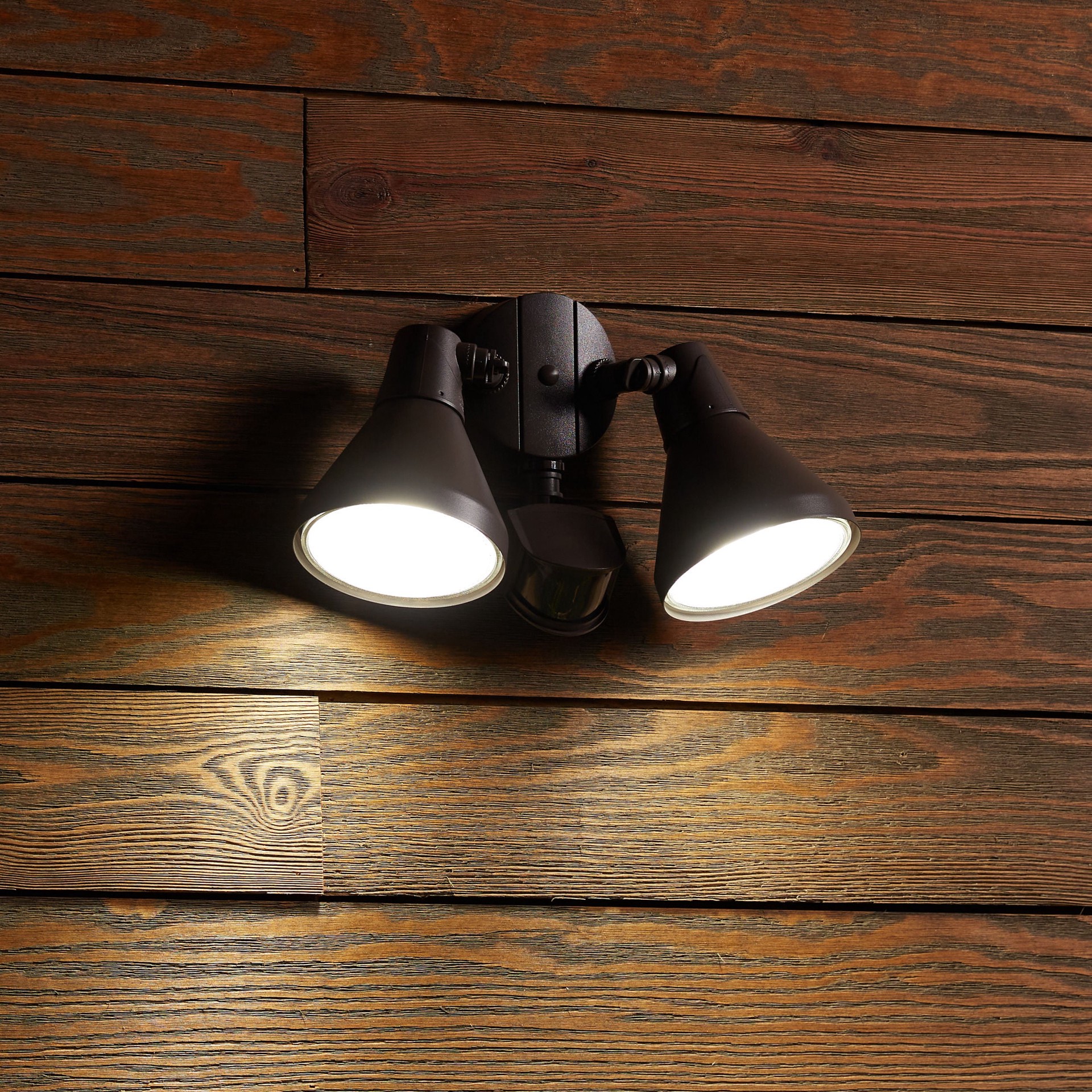 slide 4 of 6, Utilitech 180 -Degree 300 -Wattage Equivalent Hardwired Halogen Bronze 2 -Head Motion-Activated Flood Light with Timer, 1 ct