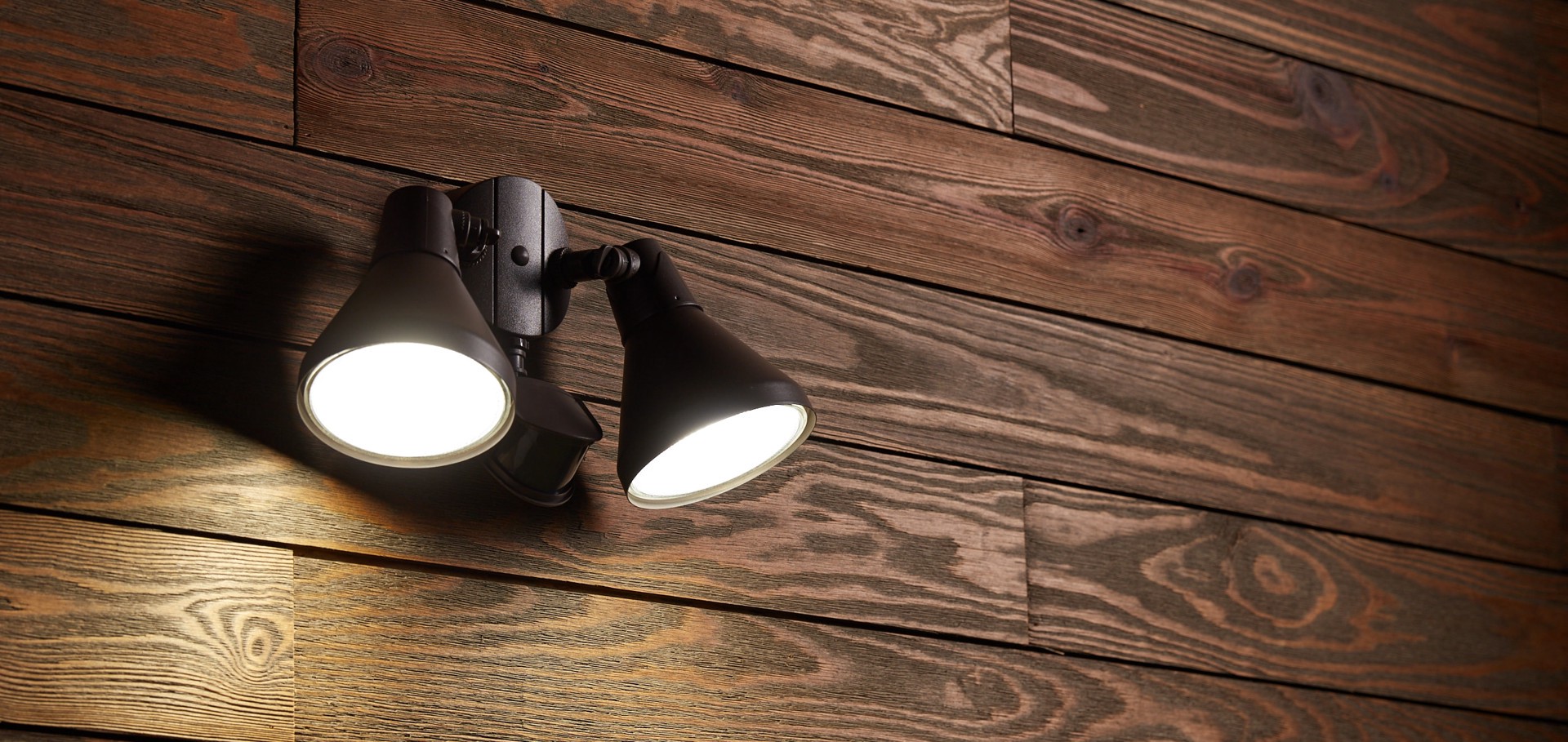 slide 5 of 6, Utilitech 180 -Degree 300 -Wattage Equivalent Hardwired Halogen Bronze 2 -Head Motion-Activated Flood Light with Timer, 1 ct