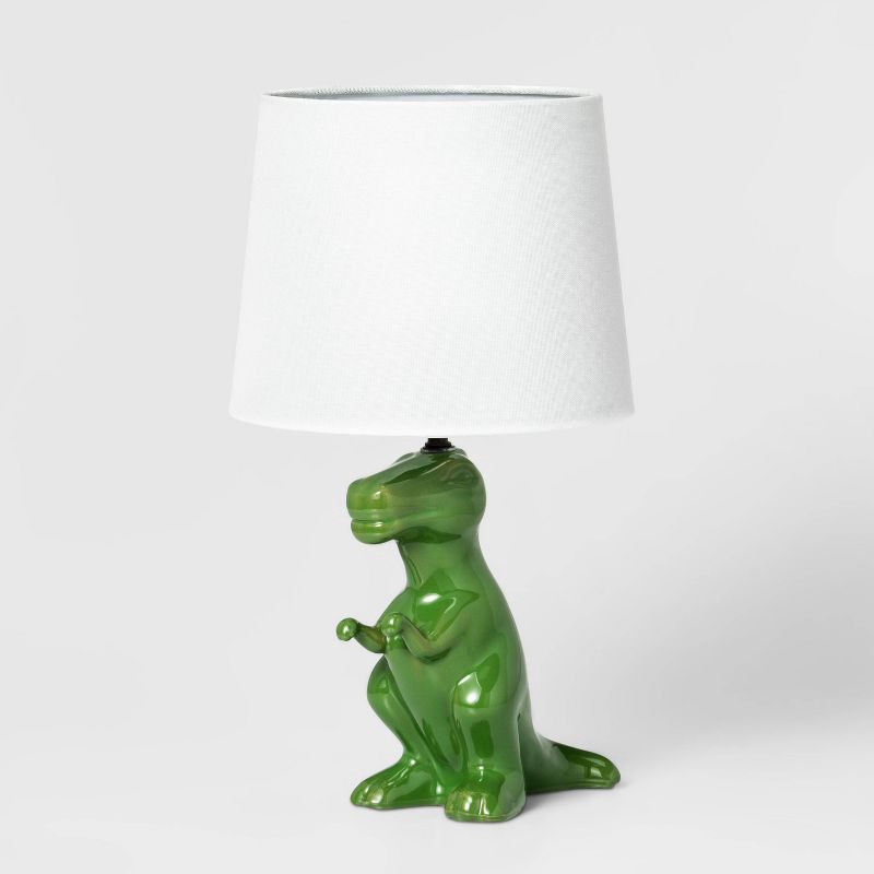 slide 2 of 5, Dinosaur Kids' Table Lamp (Light Bulbs Not Included) Green - Pillowfort™: Dino Lights for Boys, Ceramic Accent Lamp, 1 ct