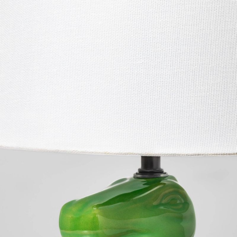 slide 4 of 5, Dinosaur Kids' Table Lamp (Light Bulbs Not Included) Green - Pillowfort™: Dino Lights for Boys, Ceramic Accent Lamp, 1 ct