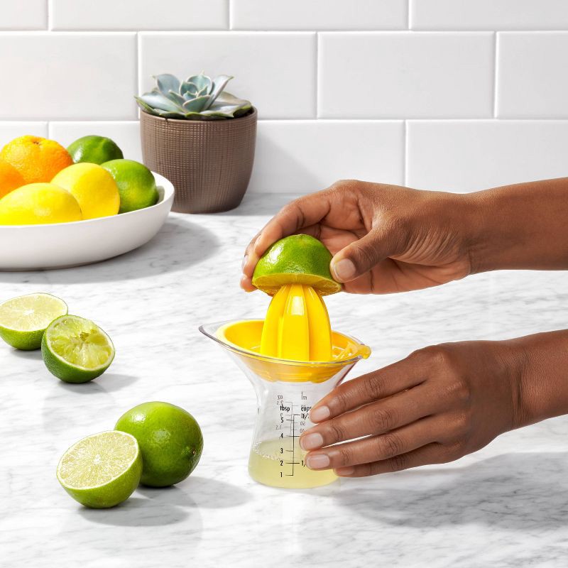 slide 7 of 9, OXO Small Citrus Reamer: Yellow Plastic Juicer, Dishwasher-Safe, 5" Height, 3.6" Width & Depth, 1 ct