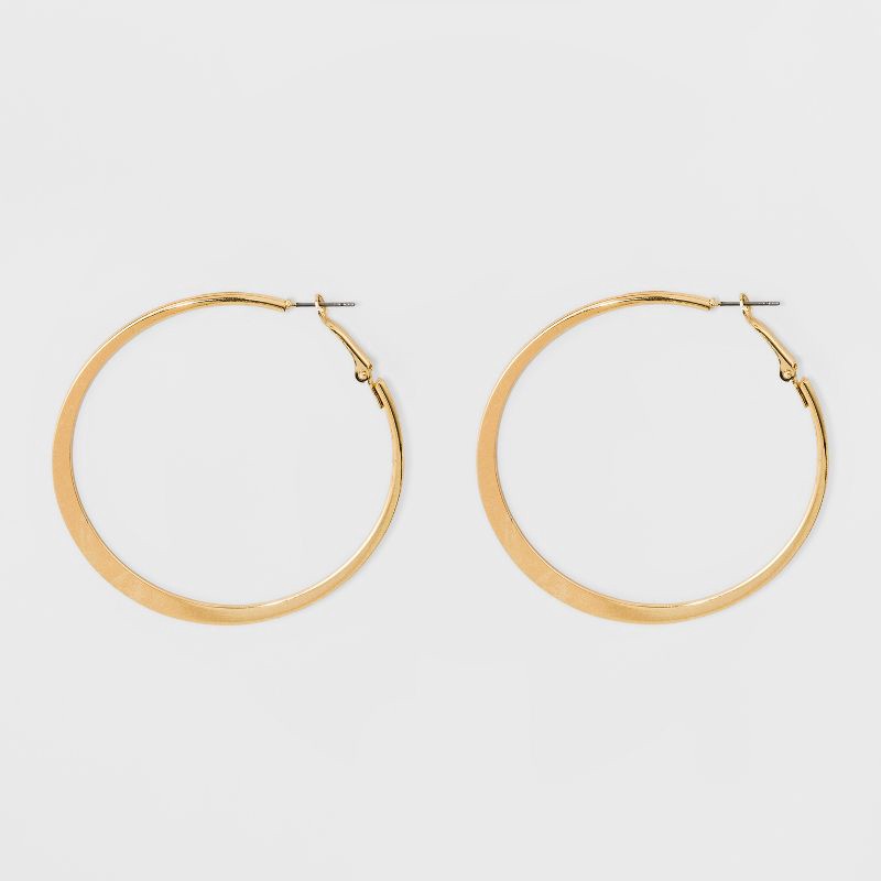 slide 1 of 3, Large Knife Edge Hoop Earrings - A New Day™ Gold: Iron, Nickel-Free, 2.6" Length, 1 ct