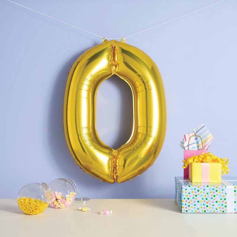 slide 2 of 4, 34" Number 0 Foil Balloon - Spritz™: Gold Birthday Decoration, Solid Pattern, All Ages, 1 ct