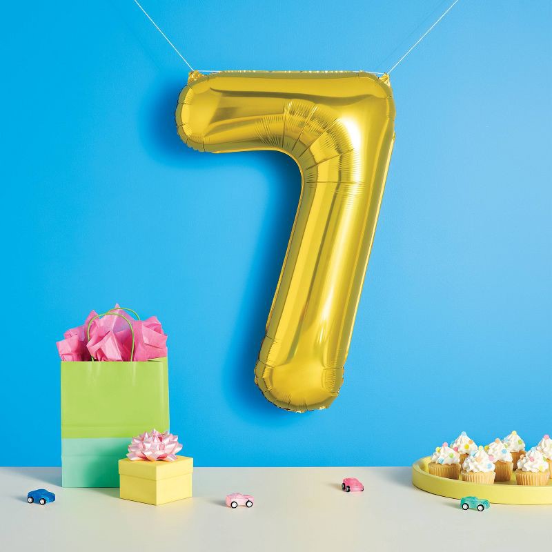 slide 2 of 4, 34" Number 7 Foil Balloon - Spritz™: Gold Birthday Decoration, Solid Pattern, All Ages, 1 ct
