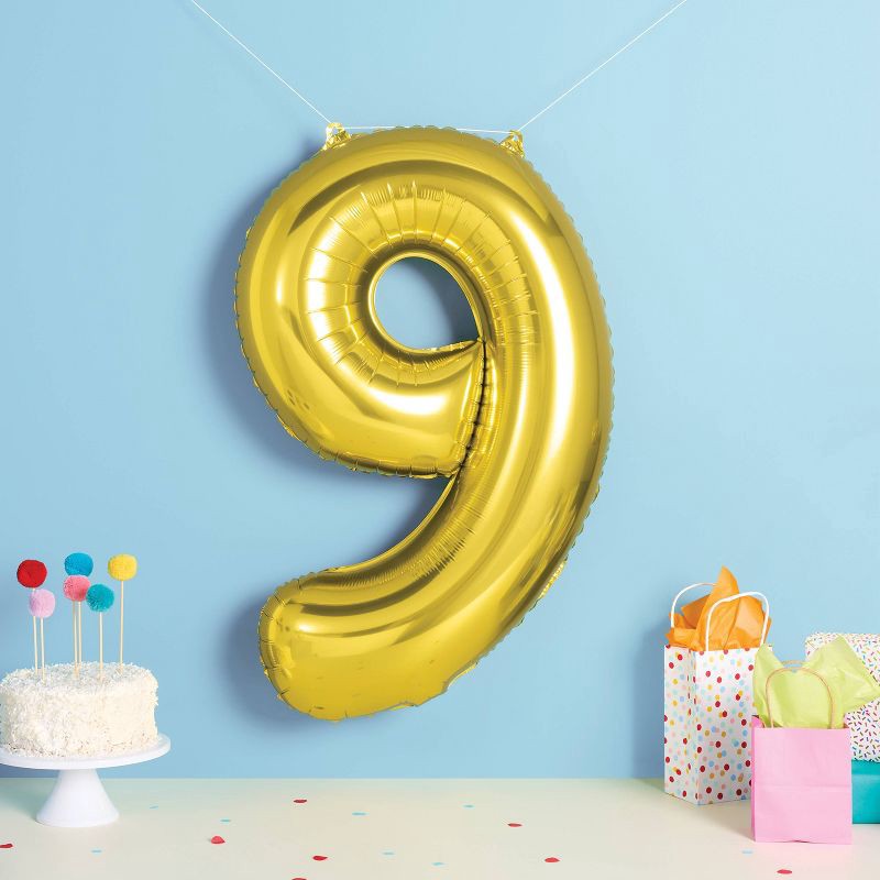 slide 2 of 4, 34" Number 9 Foil Balloon - Spritz™: Gold Birthday Decoration, Solid Pattern, All Ages, 1 ct