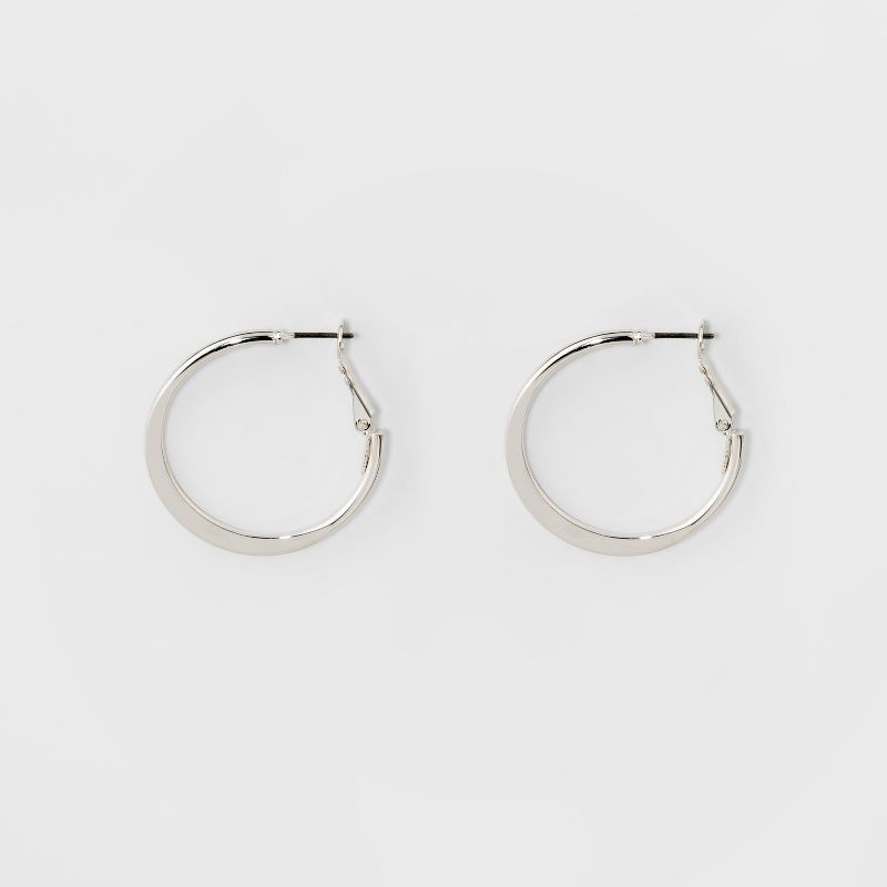 slide 1 of 1, Medium Flat Hoop Earrings - A New Day™ Silver: Shiny Nickel-Free Iron, Leverback Closure, 1.3" Diameter, 1 ct