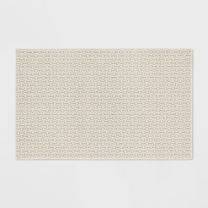 slide 1 of 3, 2'6"x3'10" Washable Solid Machine Tufted Accent Rug Tan - Threshold™: Skid-Resistant Indoor Low Pile Carpet, 1 ct
