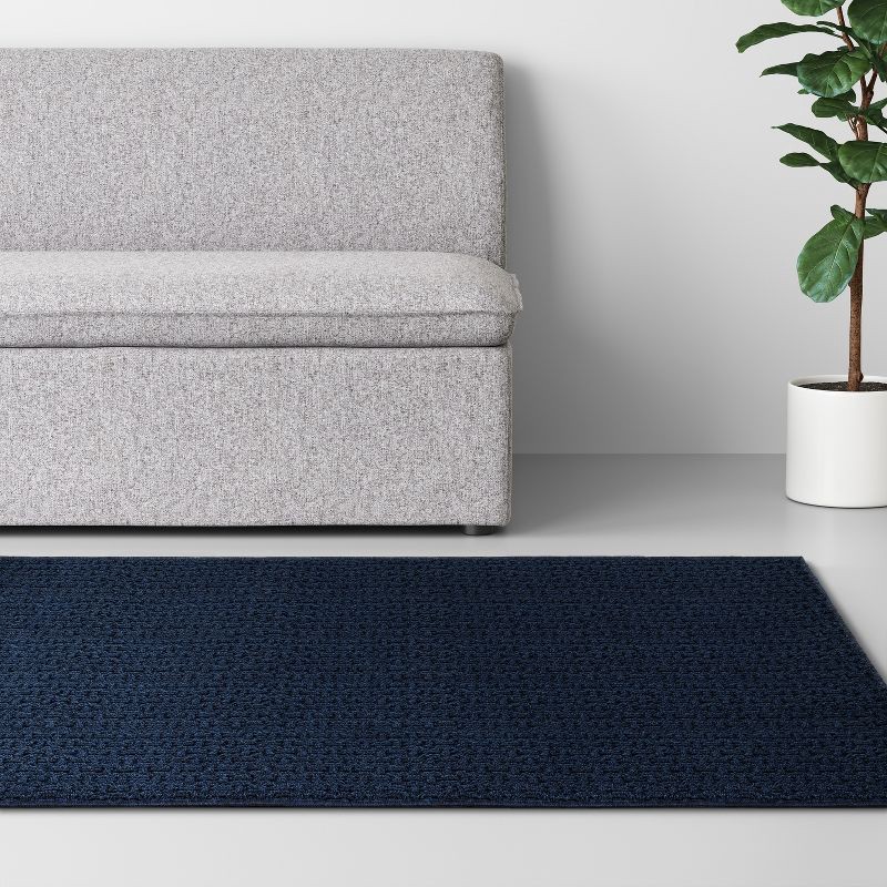 slide 3 of 4, 4'x5'6" Washable Solid Machine Tufted Accent Rug Blue - Threshold™: Skid-Resistant, Low Pile, Indoor Use, 1 ct