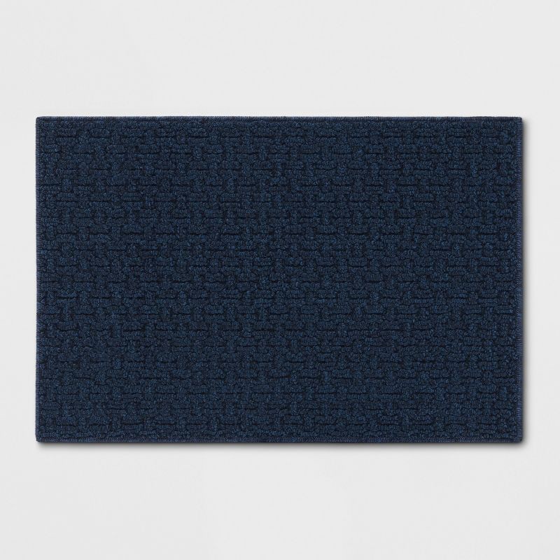 slide 1 of 3, 1'8"X2'6" Washable Solid Machine Tufted Accent Rug Blue - Threshold™, 1 ct
