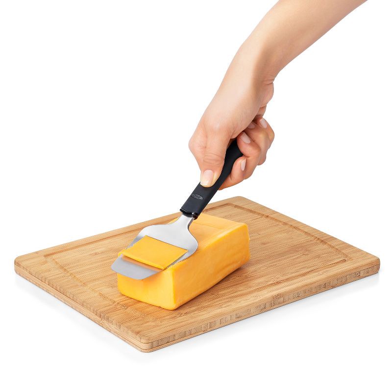 slide 2 of 4, OXO Stainless Steel Plane Slicer: Cheese Slicer, Dishwasher-Safe, Black, Kitchen Tool, 8.5" Height, 2.6" Width, 1 ct