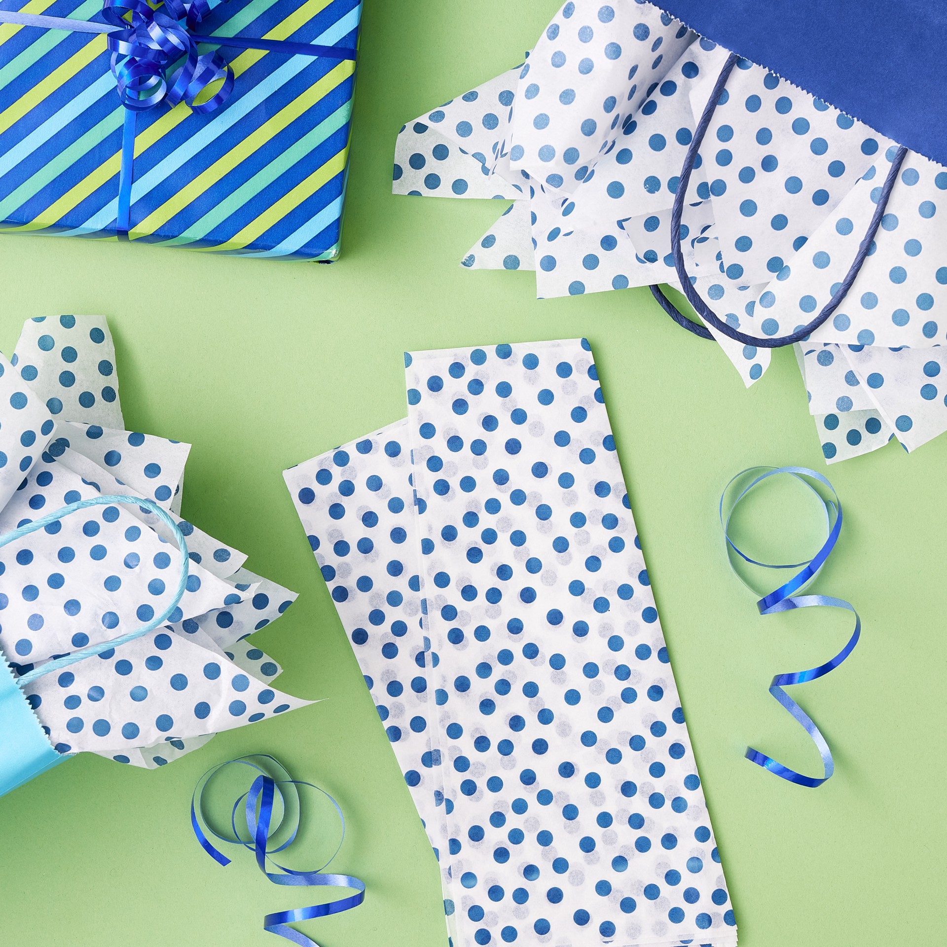 slide 3 of 3, White & Navy Dotted Tissue Paper Sheets By Celebrate It, 20 in x 26 in