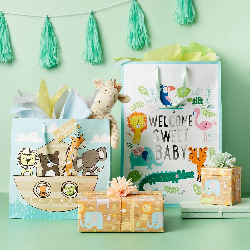 slide 2 of 3, XL 'Welcome Sweet Baby' Jungle Colossal Cub Gift Bag - Spritz™, 1 ct