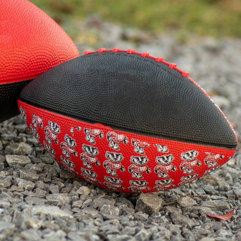 slide 2 of 3, NCAA Michigan Wolverines Team Football: Leather Shell, Rubber Bladder, Ages 5+, 1 ct