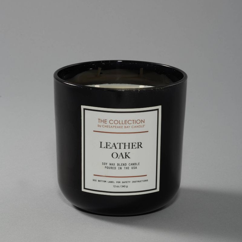 slide 3 of 3, 2-Wick Black Glass Leather Oak Lidded Jar Candle 12oz - The Collection by Chesapeake Bay Candle, 12 oz