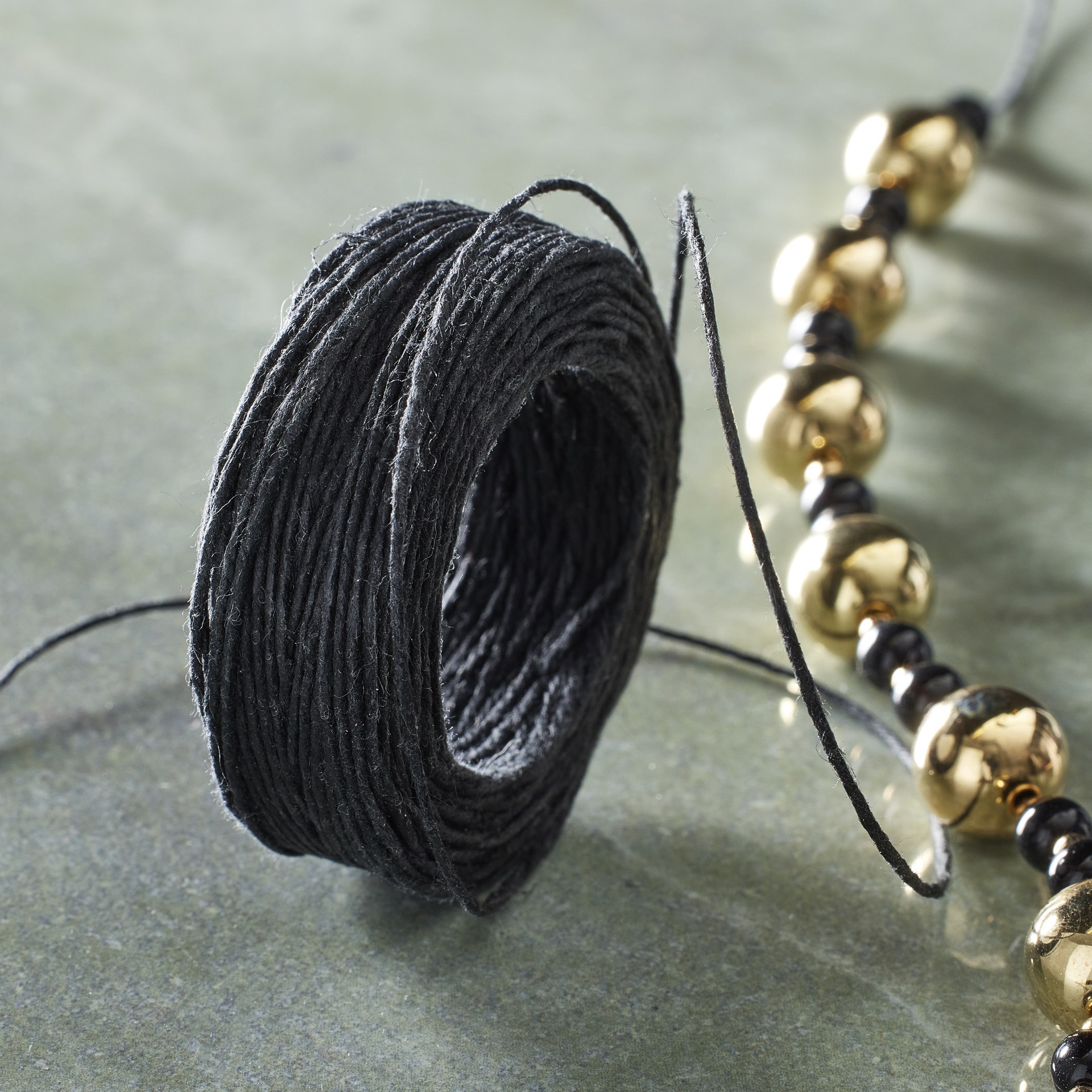 slide 2 of 3, Black Waxed Linen Cord By Bead Landing, 25 yd