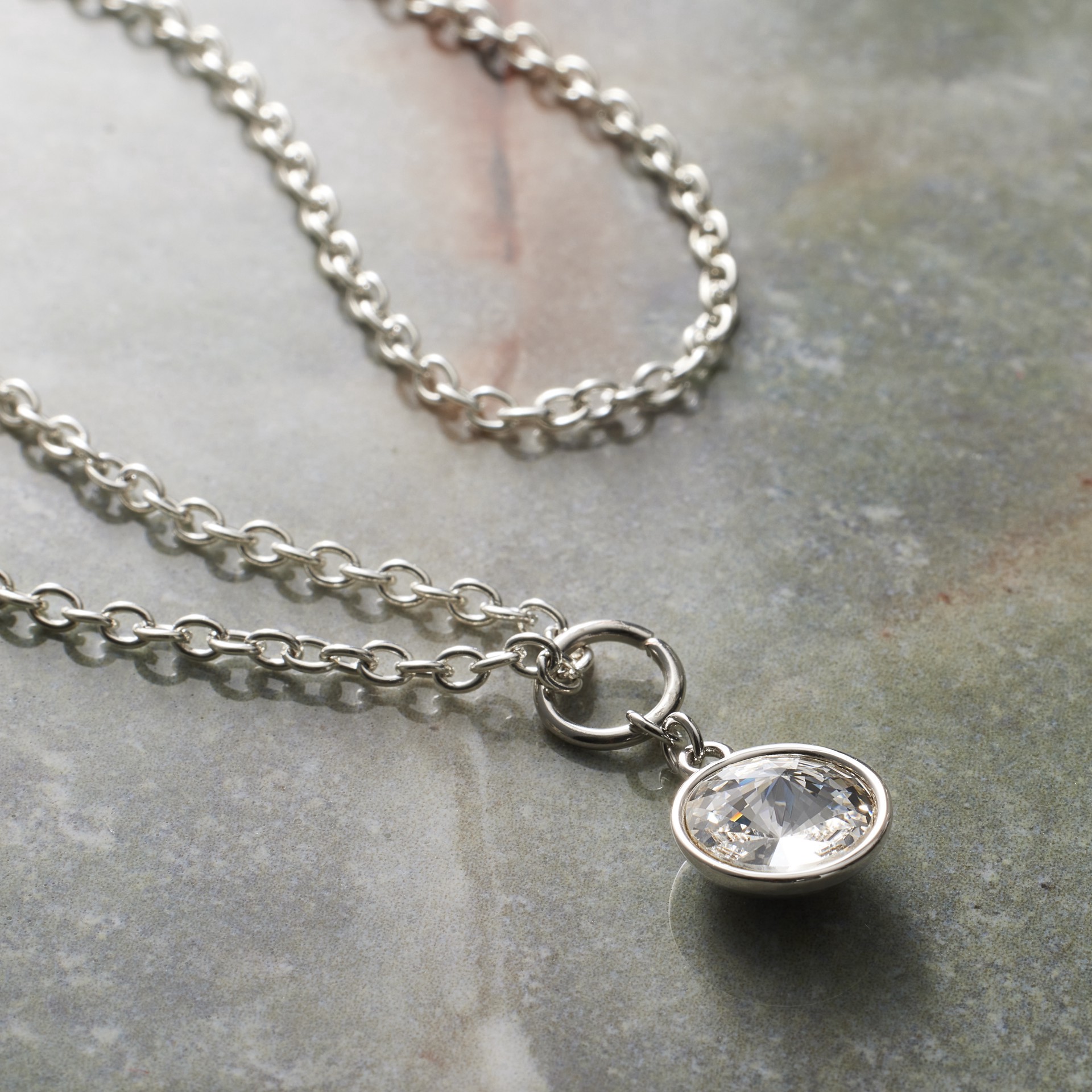 slide 4 of 5, Clear Austrian Crystal Rivoli Cut Charm In Silver Setting By Bead Landing, 4mm x 5mm