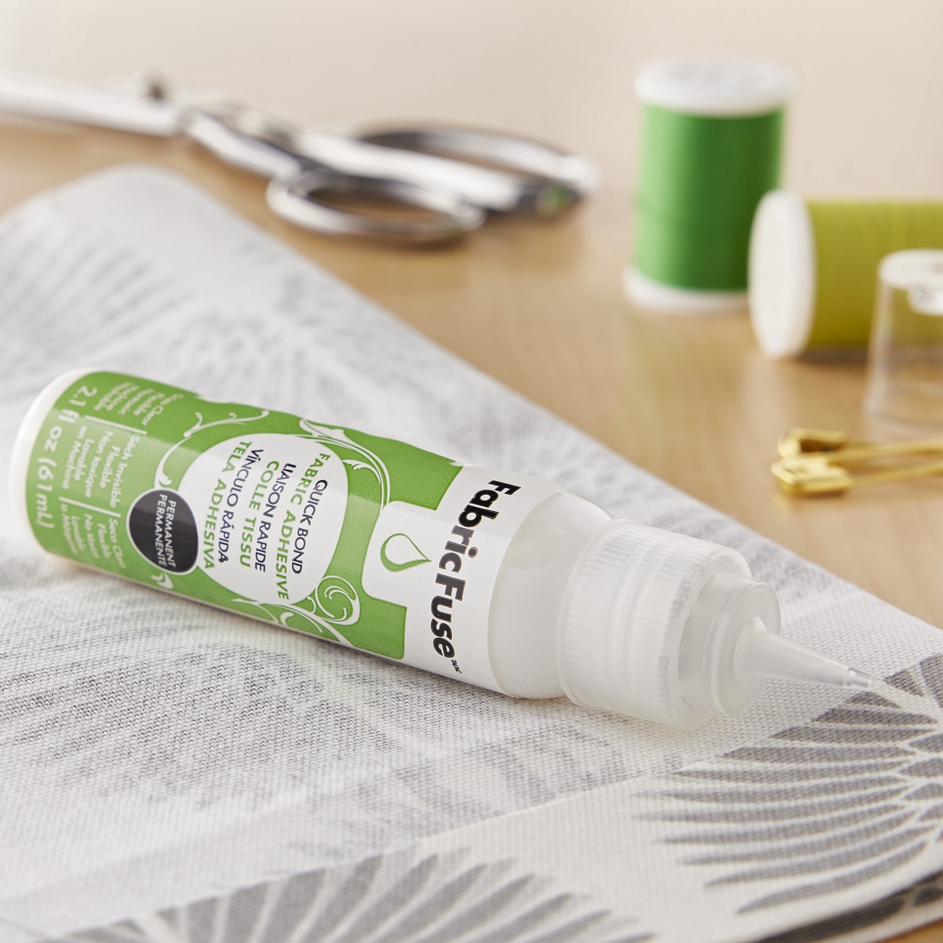 slide 2 of 3, Therm O Web Thermoweb Liquid Fabric Fuse Adhesive, 2.1 fl oz