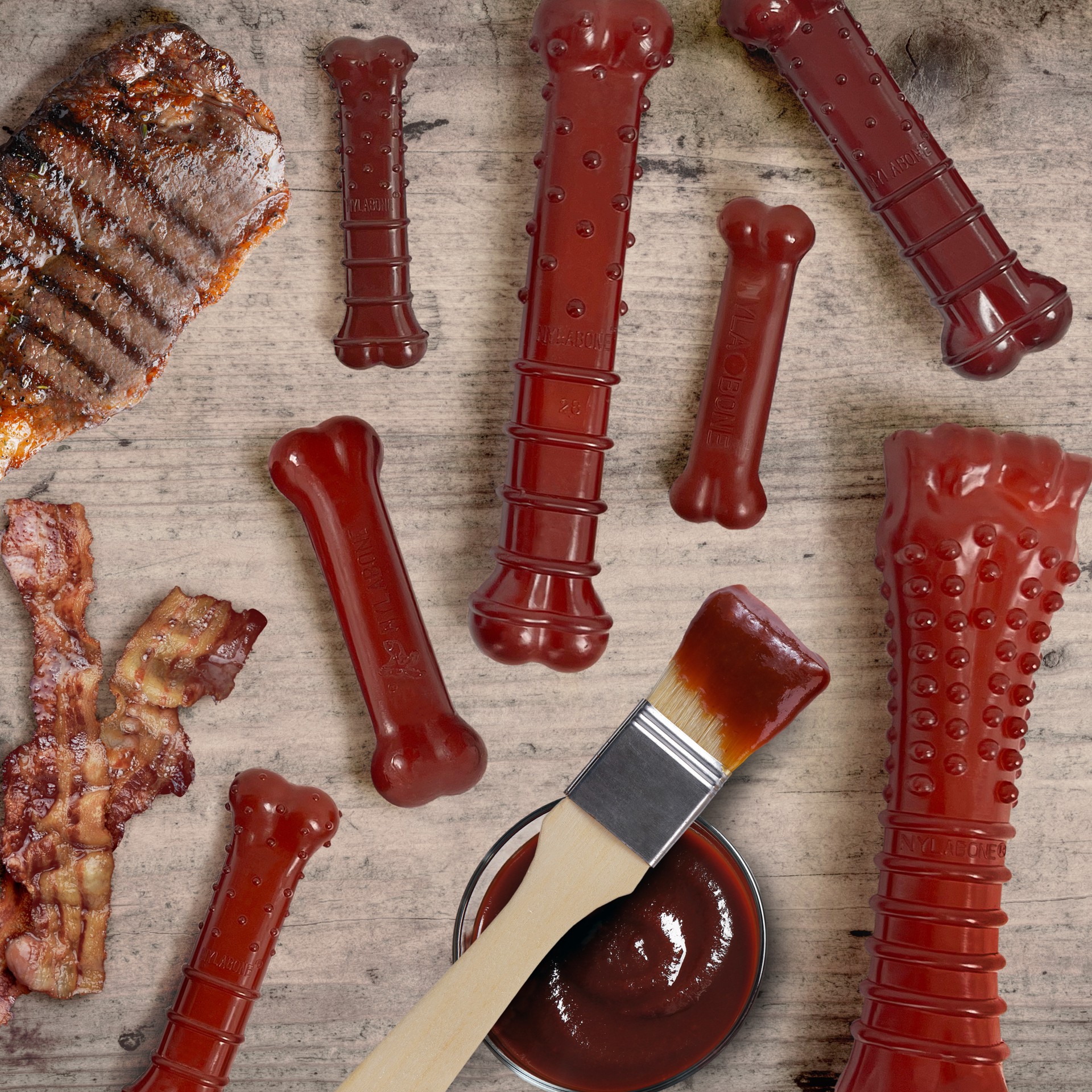 slide 9 of 10, Nylabone Bacon Basted Flavor/Steak Flavor Dog Toy 1 Each, 1 ct