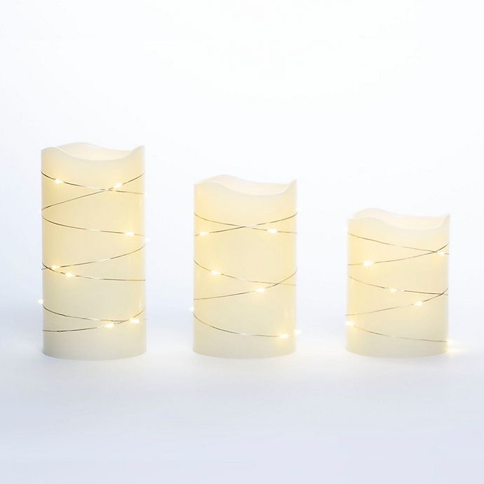 slide 2 of 2, Candle Impressions Pillar Candle with String Lights - Cream, 3 ct