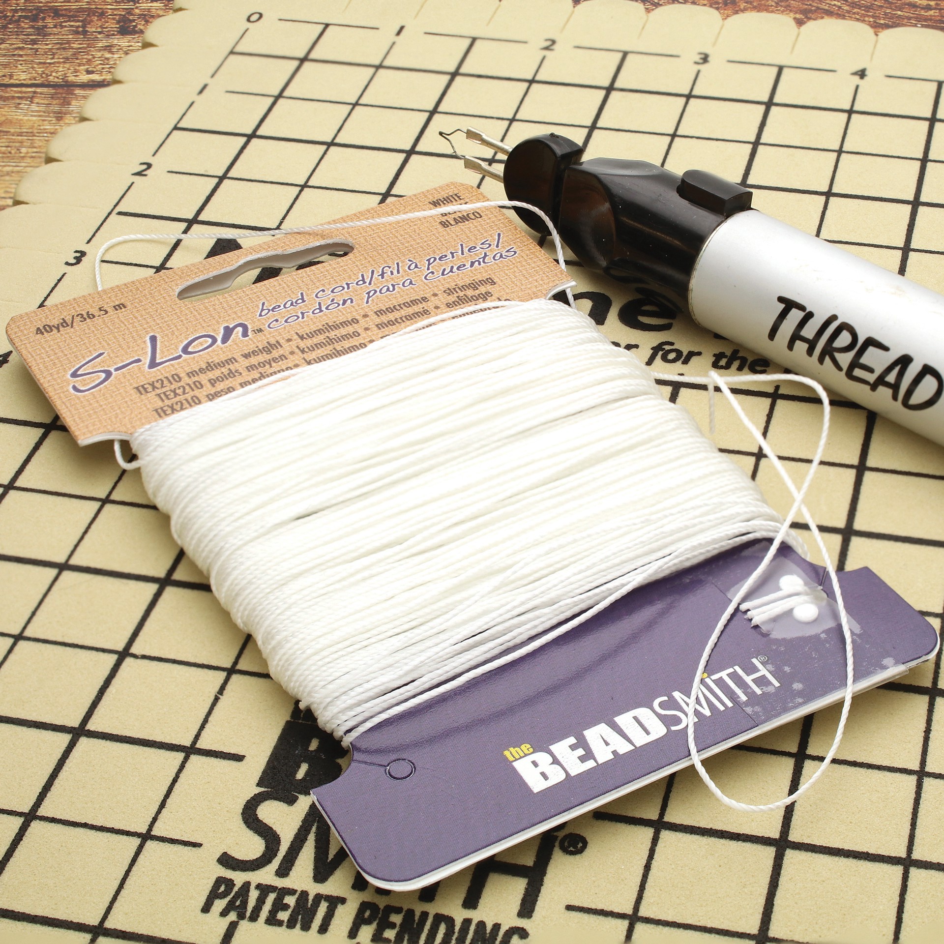 slide 4 of 7, The Beadsmith S-Lon 0.5mm White Bead Cord, 0.5mm