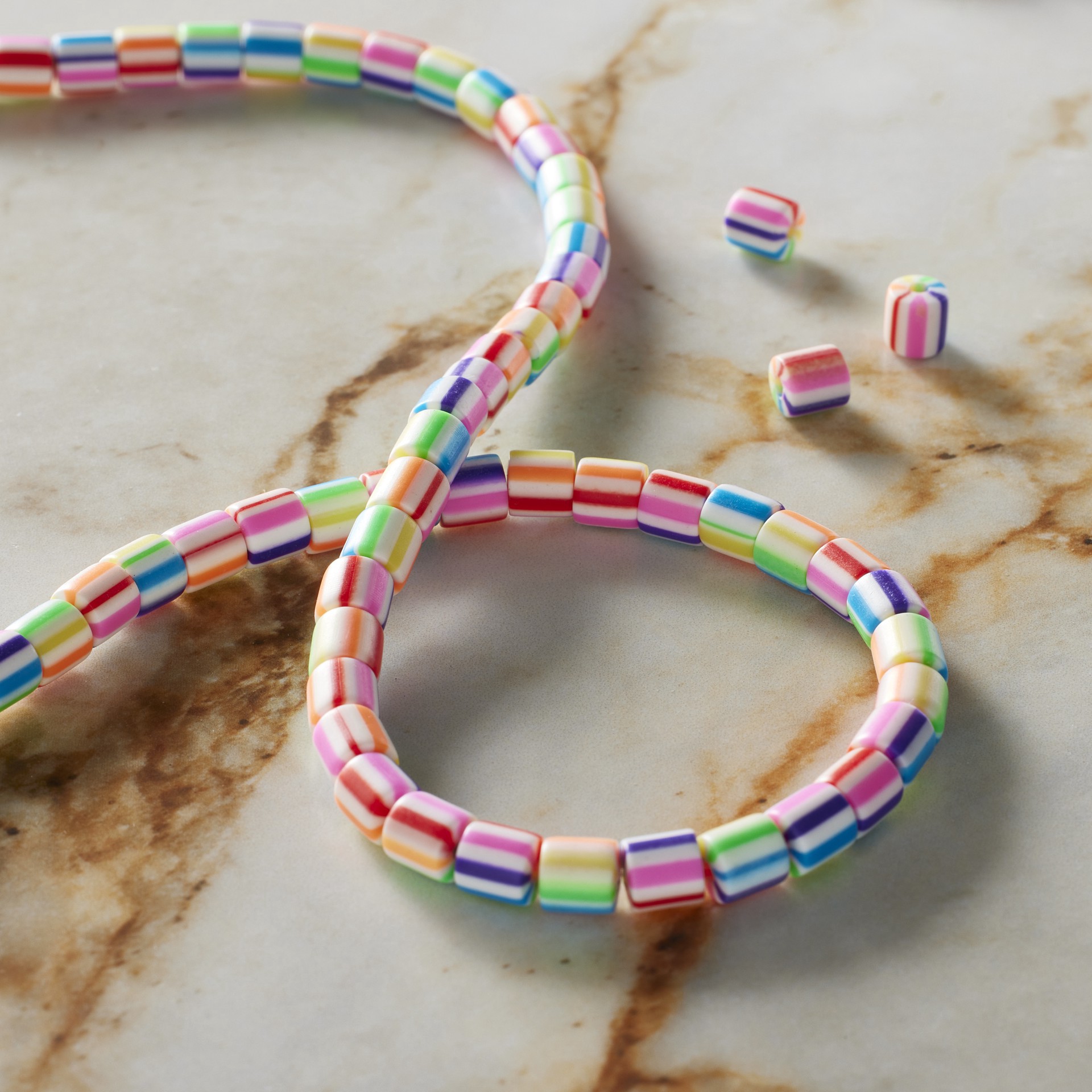 slide 2 of 3, Multicolor Striped Clay Tube Beads, 5.8mm By Bead Landing, 5.8mm