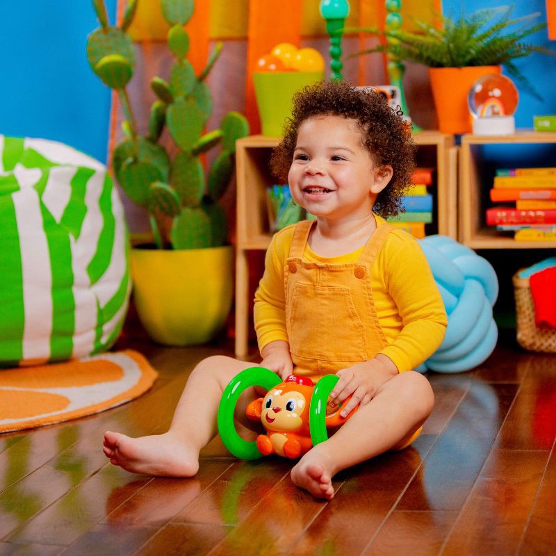 slide 11 of 17, Bright Starts Roll & Glow Monkey, 1 ct