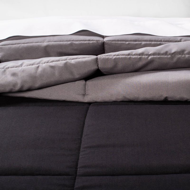 slide 3 of 5, Full/Queen Reversible Microfiber Solid Comforter Black/Dark Gray - Room Essentials, 1 ct
