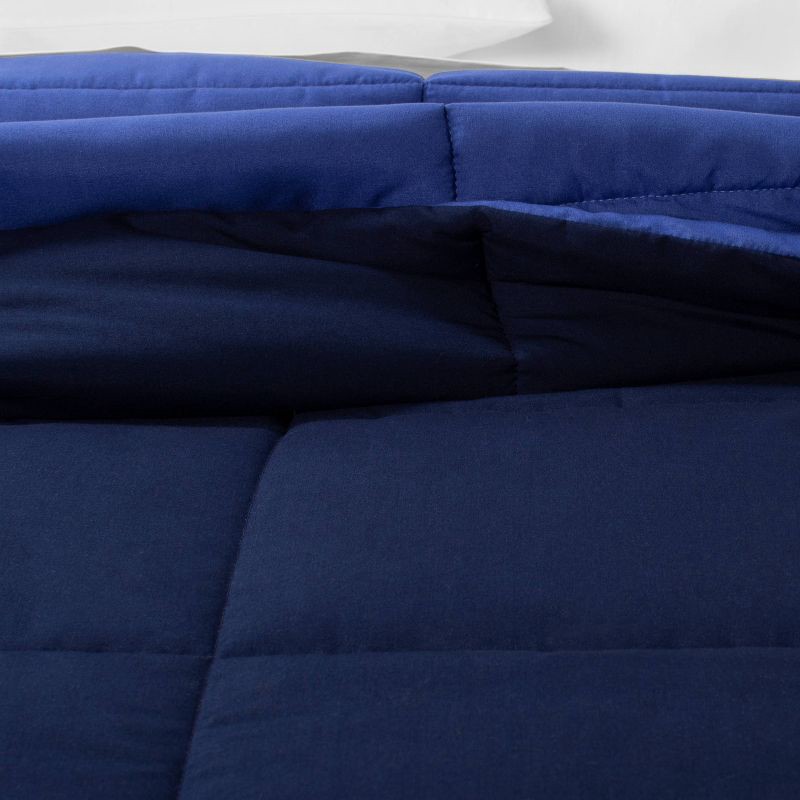 slide 4 of 5, Full/Queen Reversible Microfiber Solid Comforter Navy/Blue - Room Essentials, 1 ct