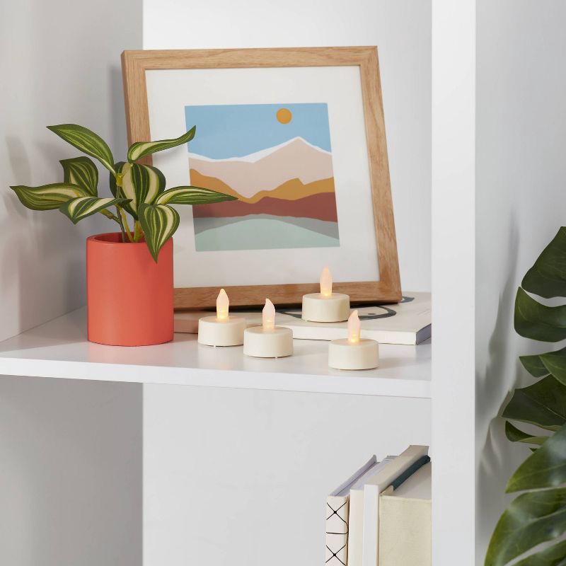 slide 2 of 3, 12ct Twist-Flame LED Tealight Candles (Cream) - Room Essentials™: Battery-Operated, Flickering, Plastic, 12 ct