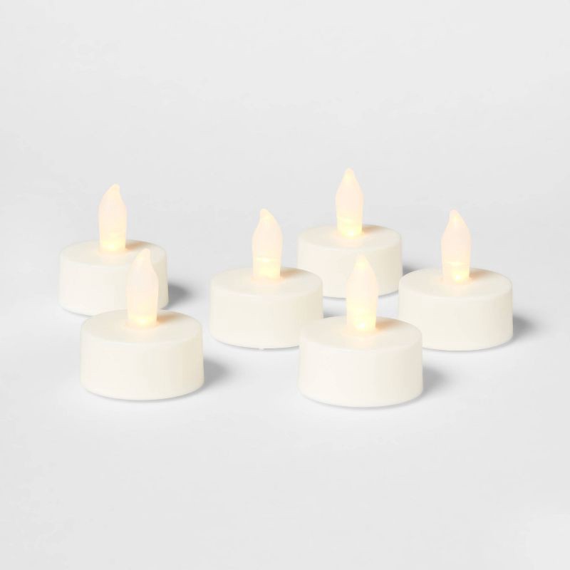 slide 3 of 3, 12ct Twist-Flame LED Tealight Candles (Cream) - Room Essentials™: Battery-Operated, Flickering, Plastic, 12 ct