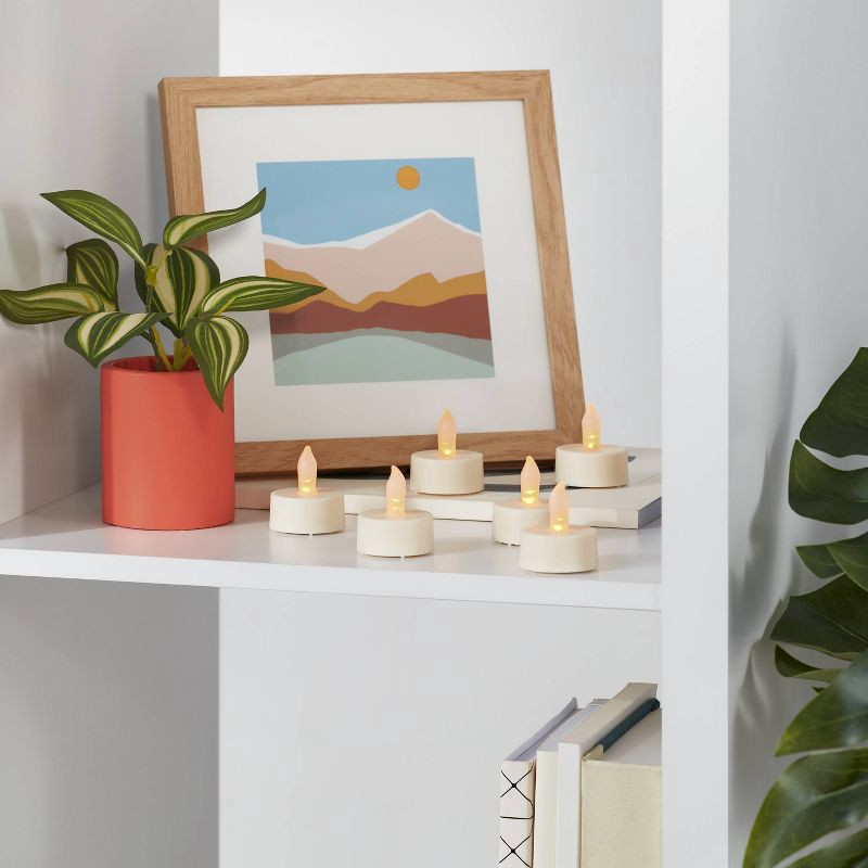 slide 2 of 3, 24ct Twist-Flame LED Tealight Candles (Cream) - Room Essentials™: Battery-Operated, Flickering Ambiance, 24 ct