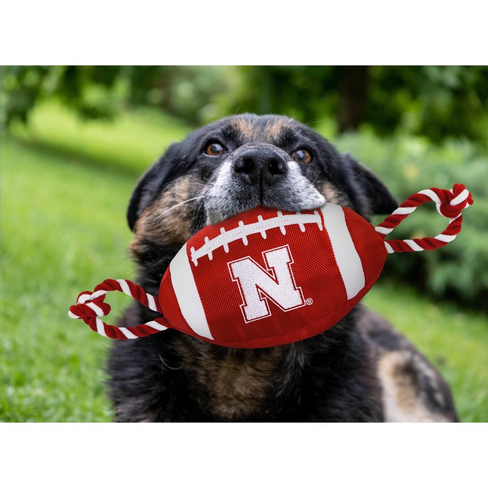 slide 2 of 2, NCAA Nebraska Cornhuskers Nylon Football Dog Toy, 1 ct