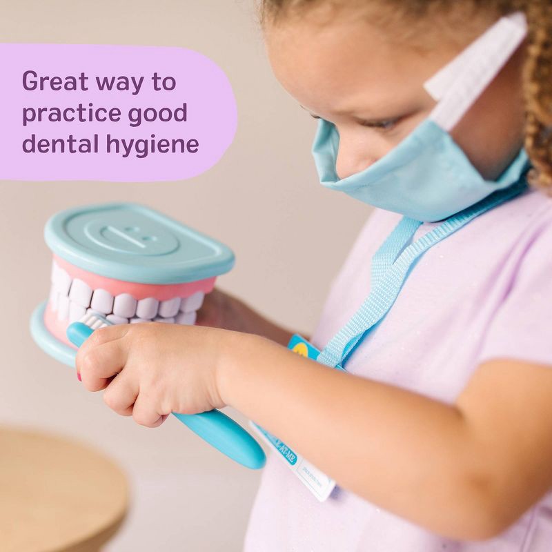 slide 8 of 9, Melissa & Doug Super Smile Dentist Kit With Pretend Play Set of Teeth And Dental Accessories (25 Toy Pieces): Educational Tooth Care Role Play Set, 1 ct