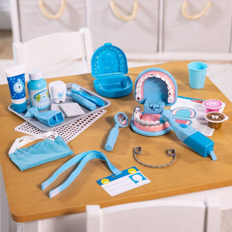 slide 9 of 9, Melissa & Doug Super Smile Dentist Kit With Pretend Play Set of Teeth And Dental Accessories (25 Toy Pieces), 1 ct