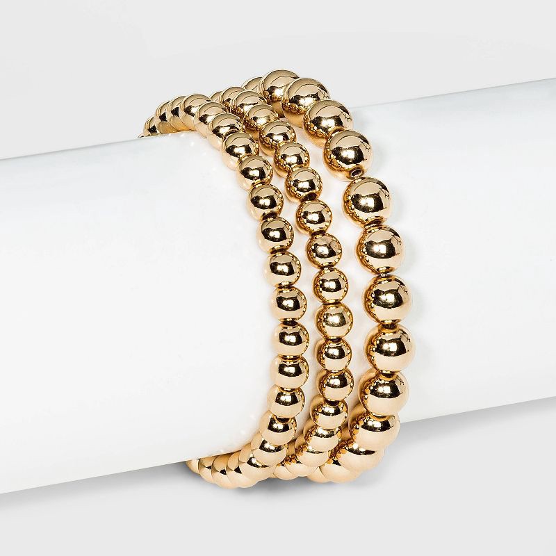 slide 1 of 2, Brass Beaded Bracelet 3pc - A New Day™ Gold: Nickel-Free Elastic Band, One Size Fits Most, 3 ct