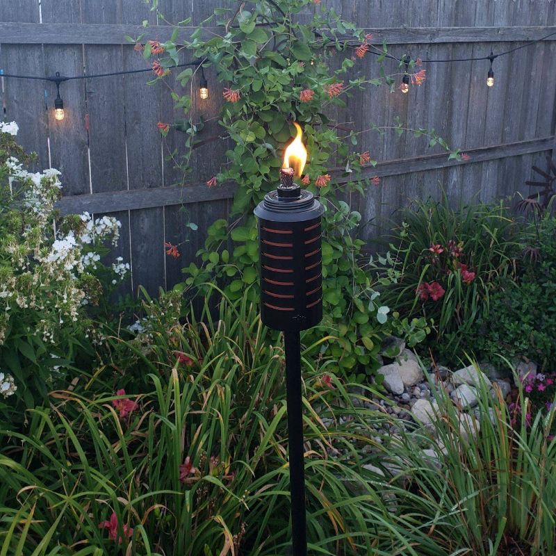 slide 2 of 8, TIKI 2pk Sea Metal Torch: Freestanding Garden Torch with Easy Install & Refillable Canister, 2 ct