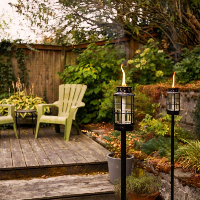 slide 2 of 4, TIKI Round Lantern StepNStall Outdoor Torch: Glass Stake Torches, Refillable, No Battery Needed, 1 ct