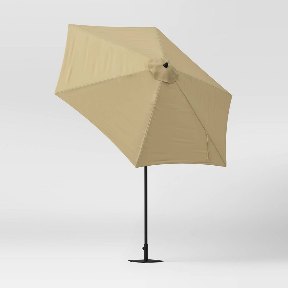 slide 2 of 6, 9' x 9' Round Patio Umbrella with Crank Lift - Tan - Room Essentials, 1 ct
