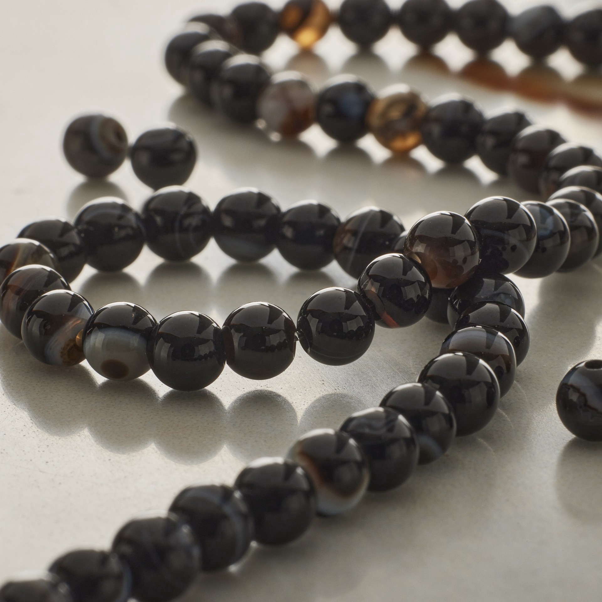 slide 2 of 3, Blue & Black Tuxedo Agate Round Beads, 4mm By Bead Landing, 4 mm