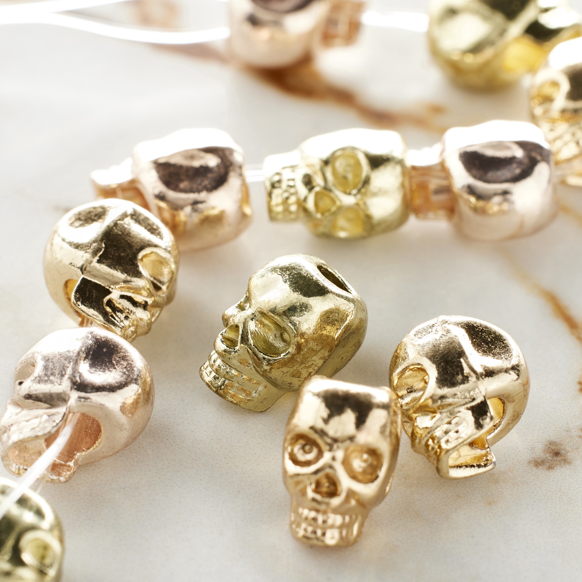 slide 3 of 3, Gold & Rose Gold Metal Skull Beads, 12mm By Bead Landing, 12mm