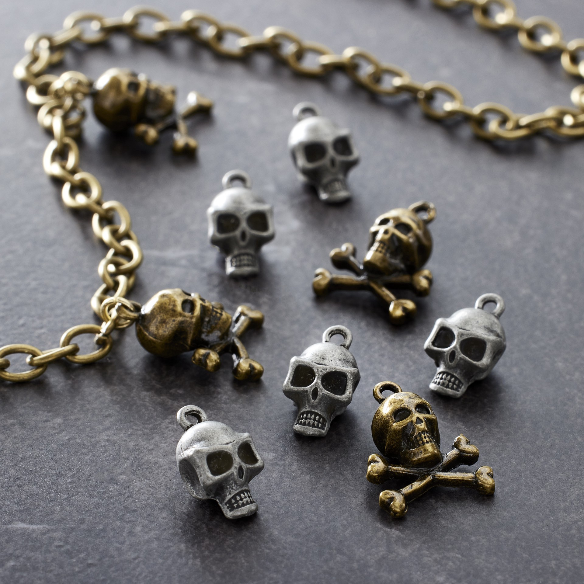slide 3 of 3, Found Objects Skull Charms By Bead Landing, 10 charms