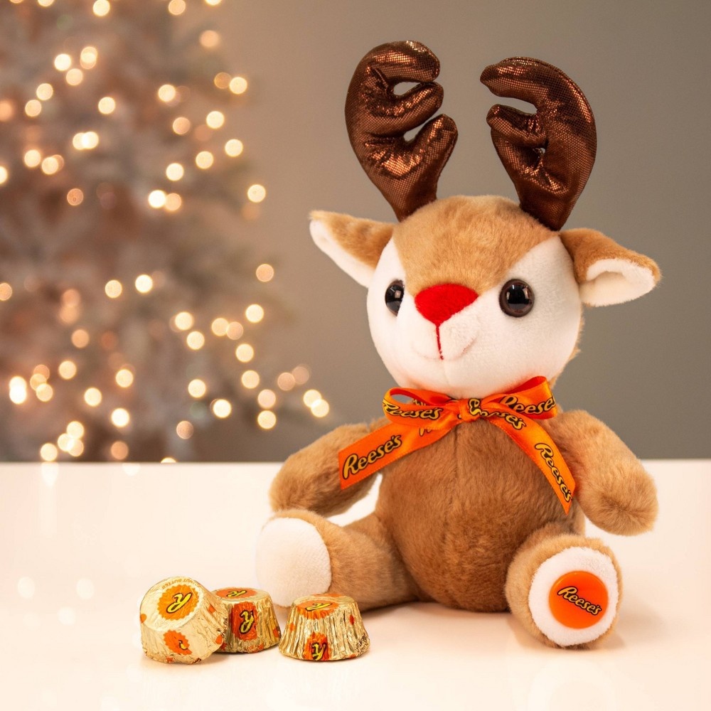 slide 2 of 3, Distributed by Target Reese's Holiday Reindeer Plush with Reese's Cups, 0.9 oz
