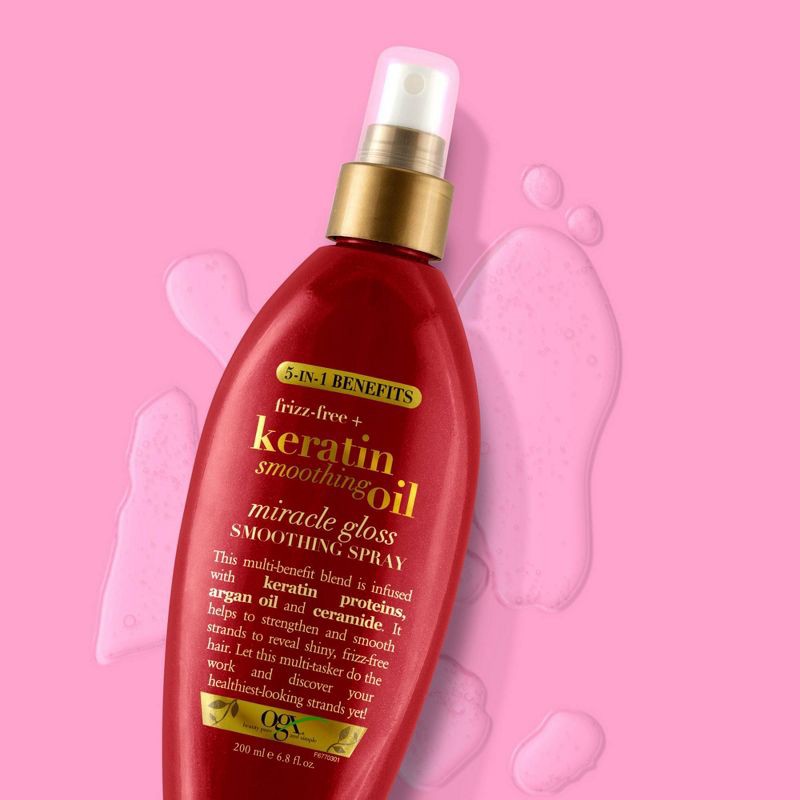 slide 3 of 3, OGX Frizz-Free + Keratin Smoothing Oil Miracle Gloss Spray, 5 in 1, De-frizz Hair, Shiny Hair - 6.8 fl oz, 6.8 fl oz