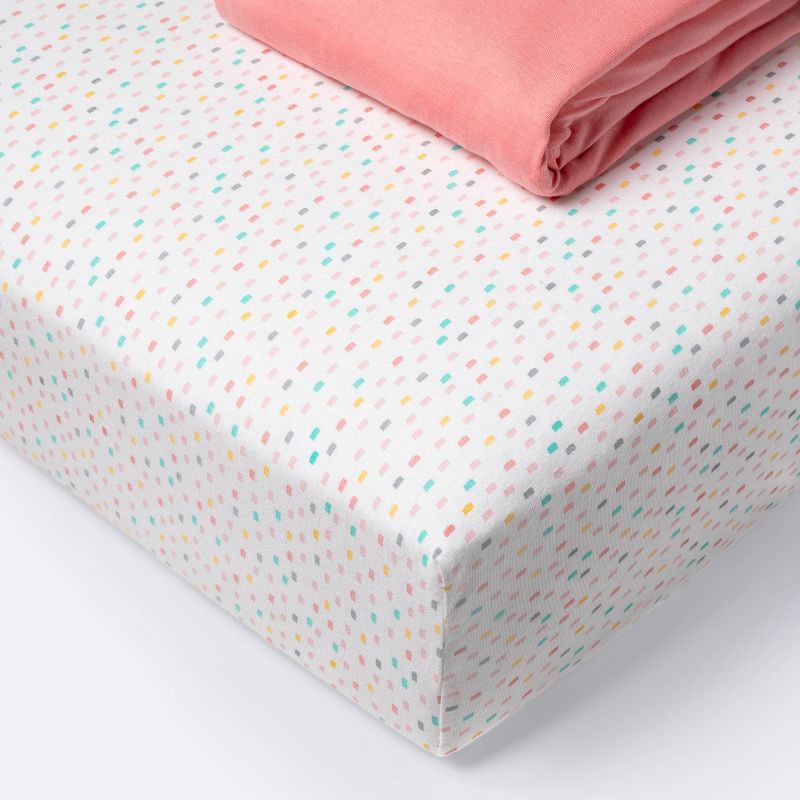 slide 1 of 3, Fitted Jersey Crib Sheet - Cloud Island™ Confetti/Coral 2pk, 2 ct