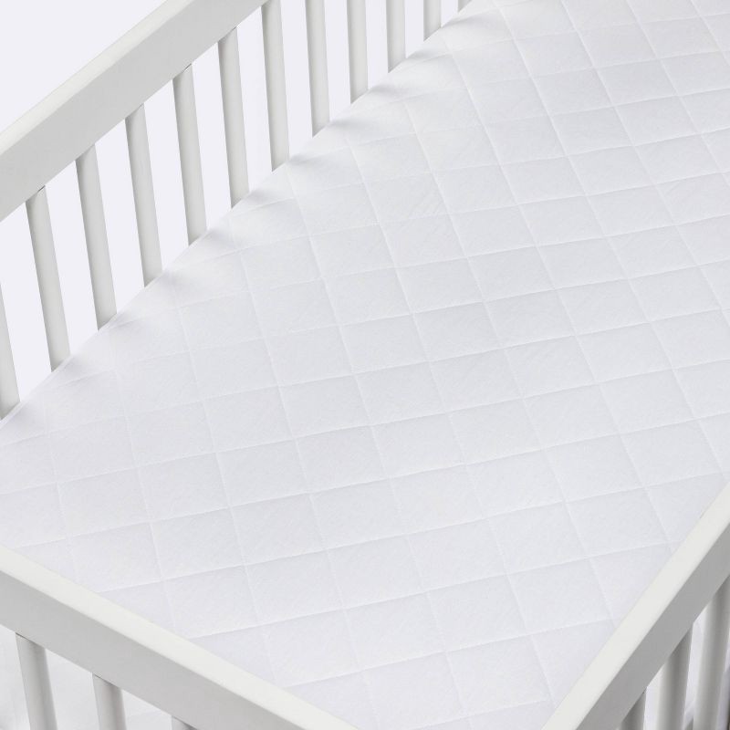 slide 2 of 3, Waterproof Fitted Crib and Toddler Mattress Pad Cover - Cloud Island™ White, 1 ct